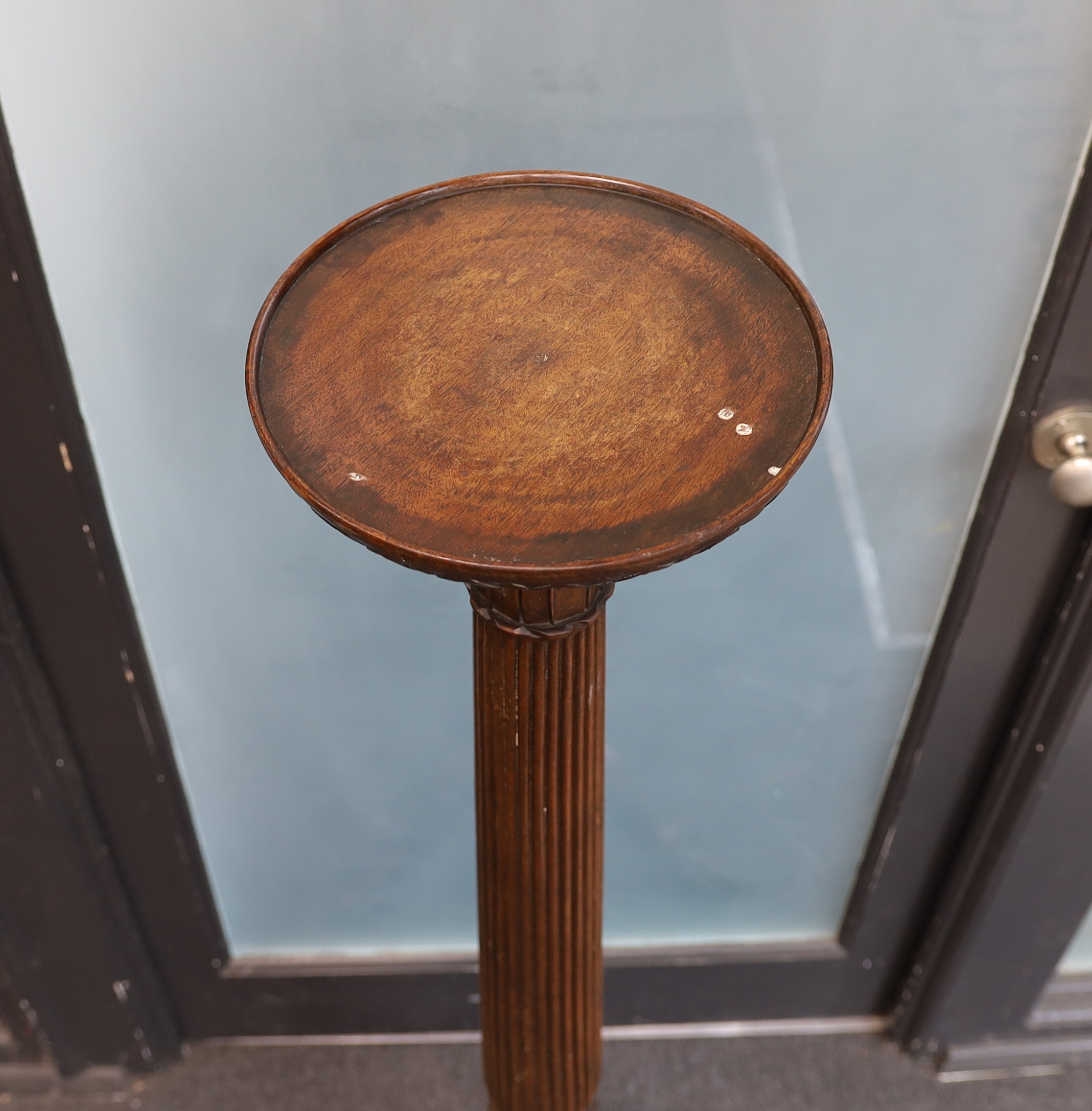 A George III style mahogany torchere, height 136cm